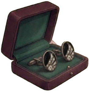 A pair of vintage cufflinks with round, reflective faces, placed inside a velvet-lined jewelry box.
