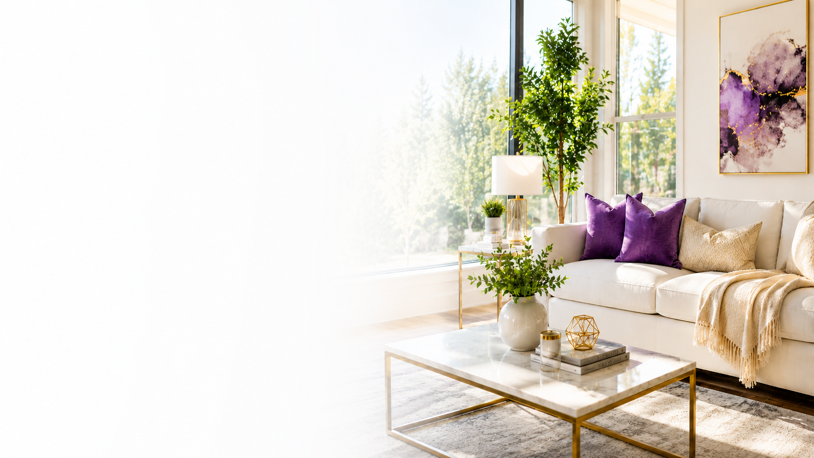 Modern living room with large window, white sofa with purple and beige pillows, framed abstract art, green plants, marble coffee table with decorative items, and a patterned rug.