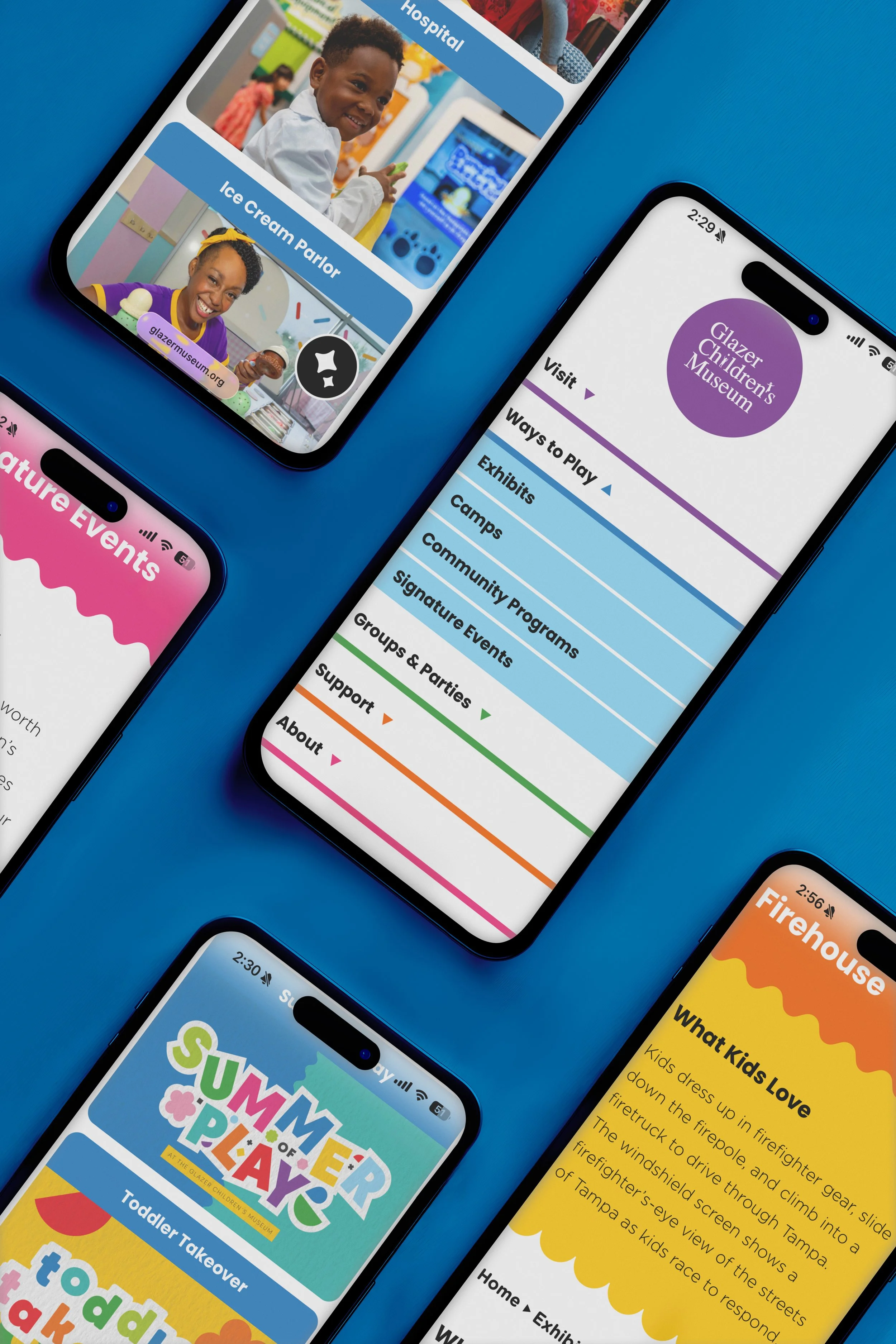 A colorful flat-lay view of mobile devices displaying the Glazer Children's Museum's dynamic website set against a blue background. It shows many views of the site, including its rainbow hamburger navigation, color-blocking organization of content, a