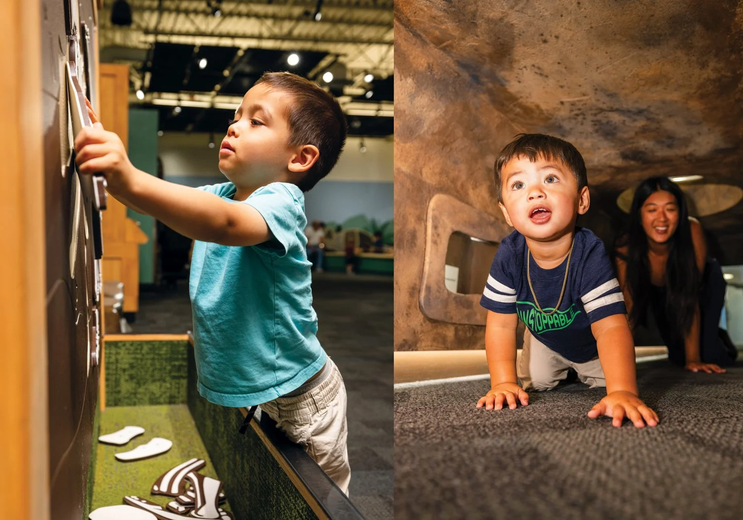 A young boy focuses intently while interacting with a magnetic Triceratops activity panel, alongside a toddler gleefully crawling through a cave tunnel while his mother smiles behind him.