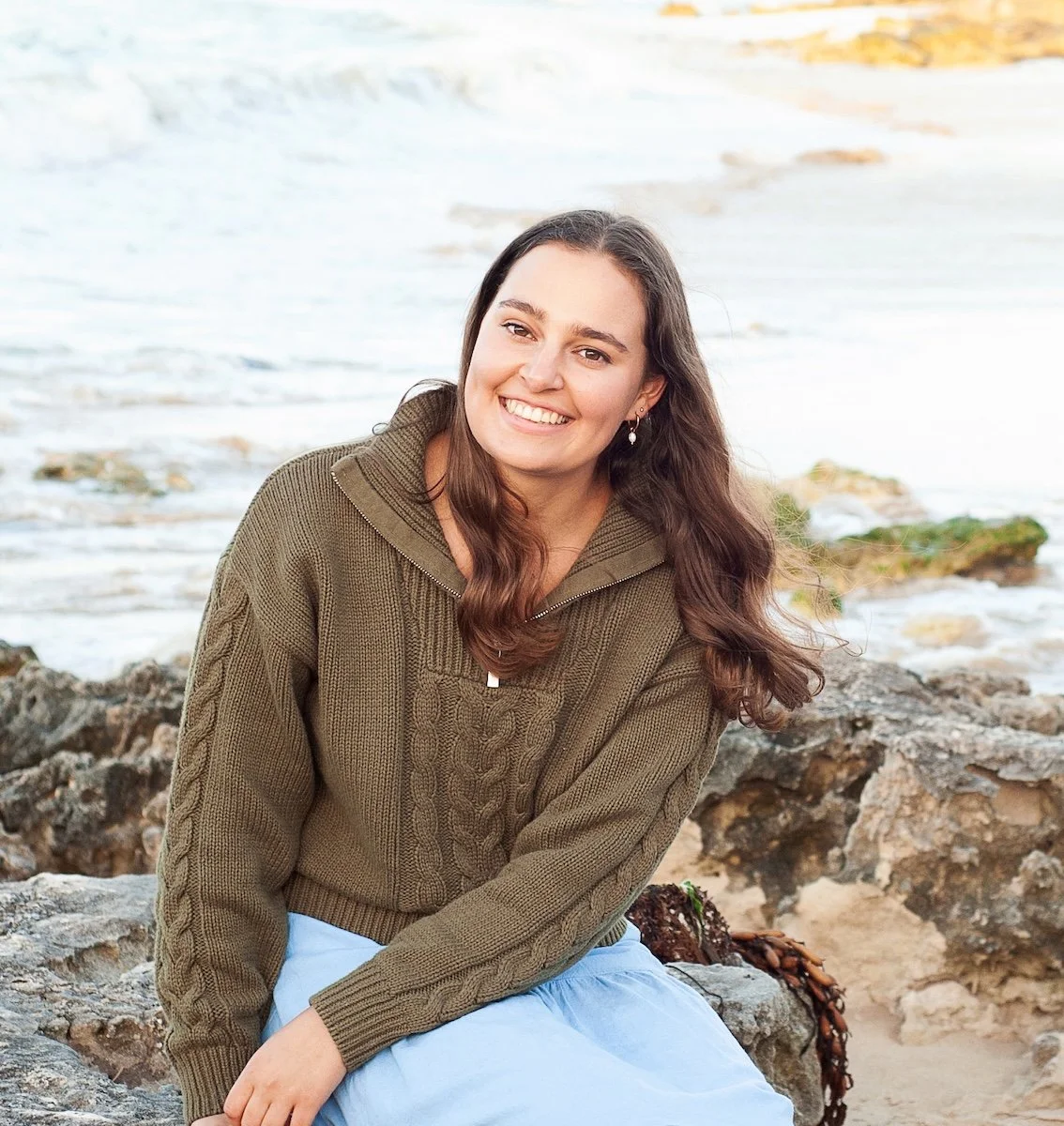 Anna, naturopath at Emily Bryson Naturopathy, smiling outdoors — women's health naturopath online