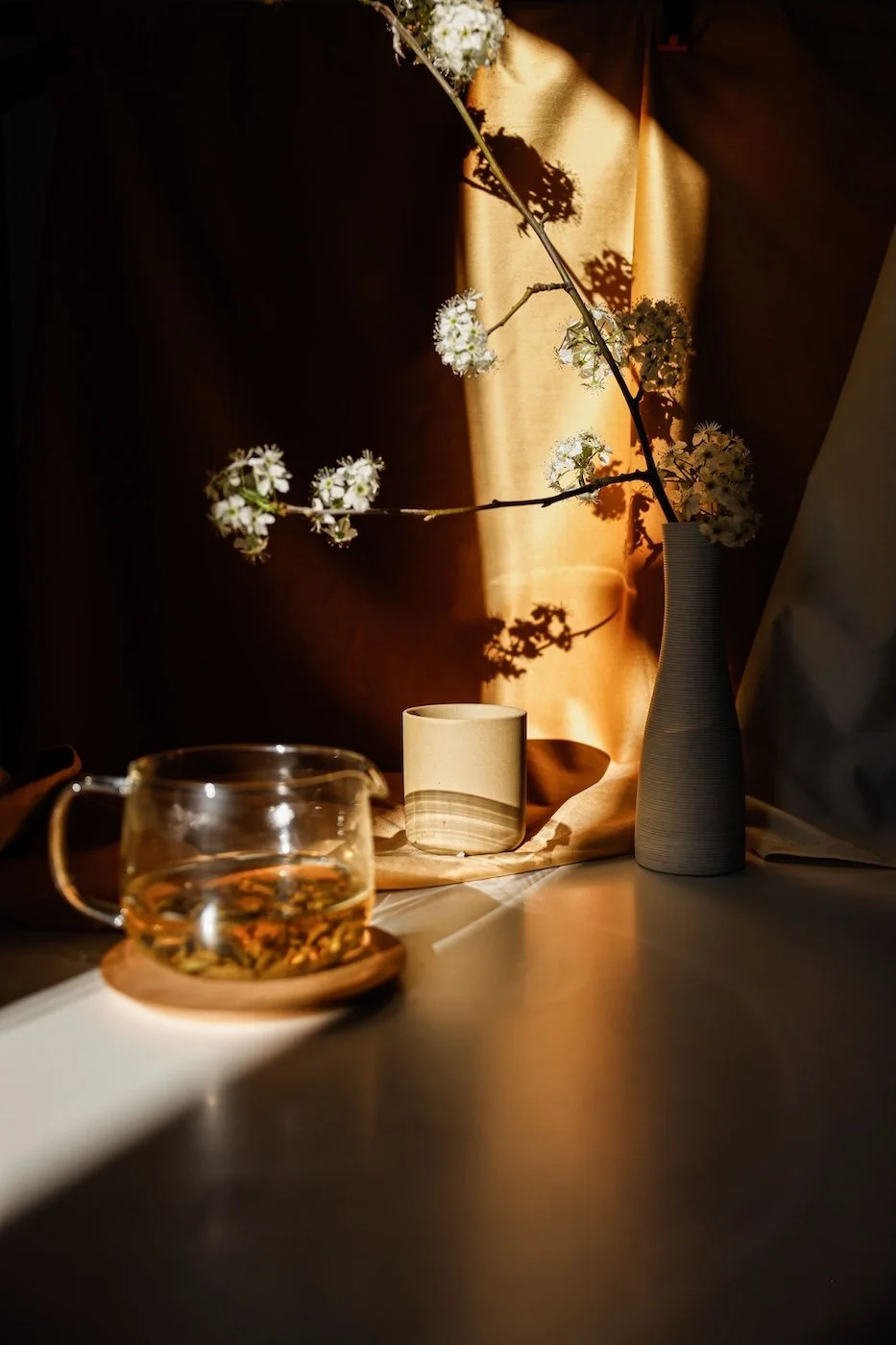 Warm still life with herbal tea and ceramics — holistic health and naturopathy