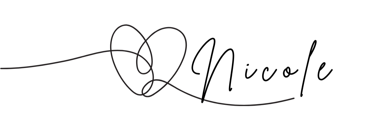 A black sewing needle with grey thread looped through its eye, on a white background.