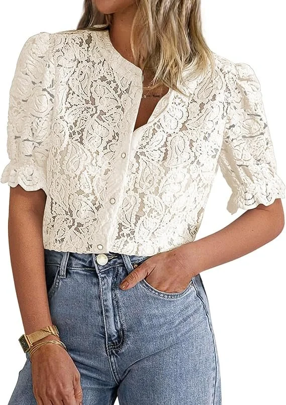 Woman wearing a cream-colored lace top with puffed sleeves and a high collar, paired with blue high-waisted jeans.