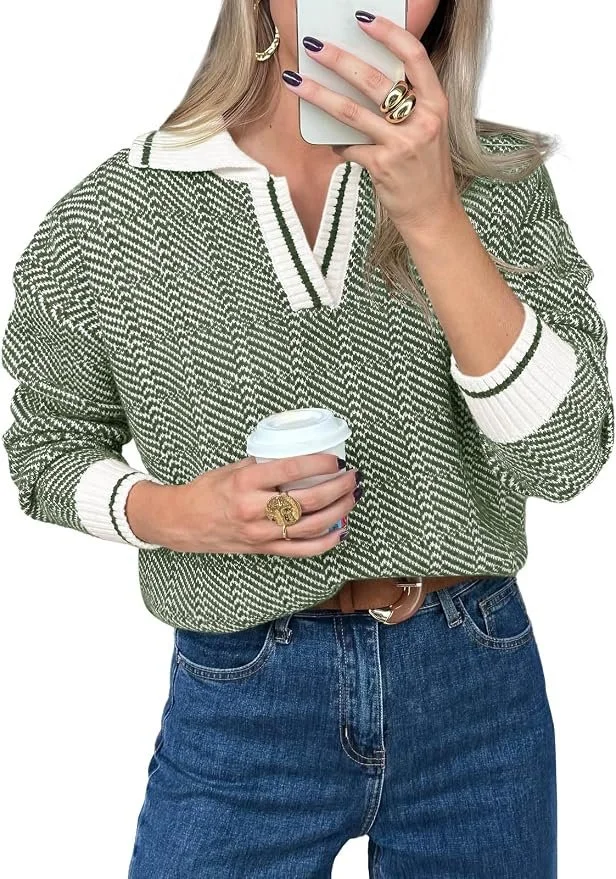 a green and white patterned sweater with white trim