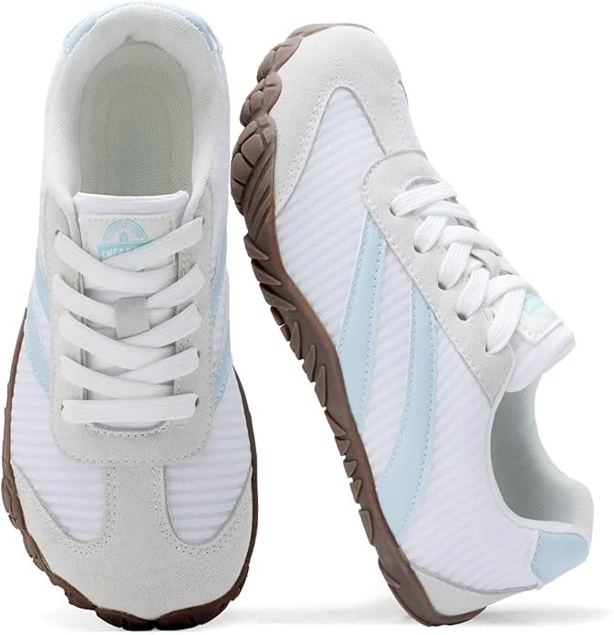 Pair of white sneakers with light blue accents and brown on the soles