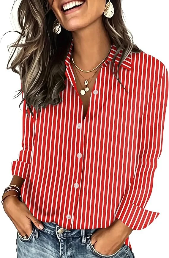 Woman wearing a red and white striped button-up shirt, with layered necklaces, large earrings, and bracelets, smiling with hands in her pockets.