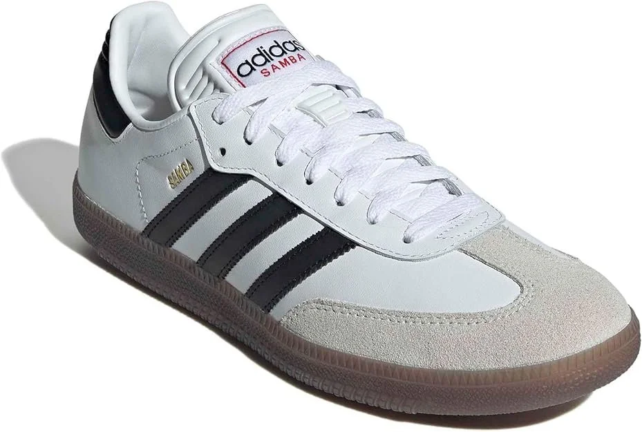 White Adidas Samba sneaker with black stripes and beige toe cap.