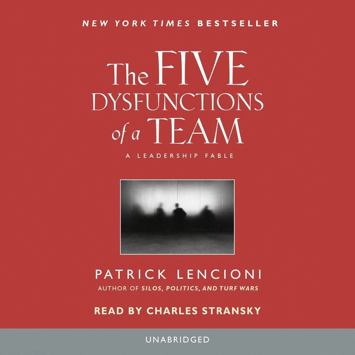 Book cover for "The Five Dysfunctions of a Team" by Patrick Lencioni, read by Charles Stransky. Red background with a small black and white photo of three blurred figures sitting at a table.
