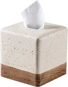 A tissue box with a white tissue protruding from the top, placed on a surface.