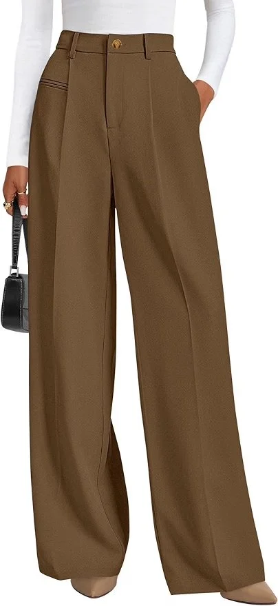 Person wearing high-waisted brown wide-leg trousers paired with a white long-sleeve top, holding a small black handbag.