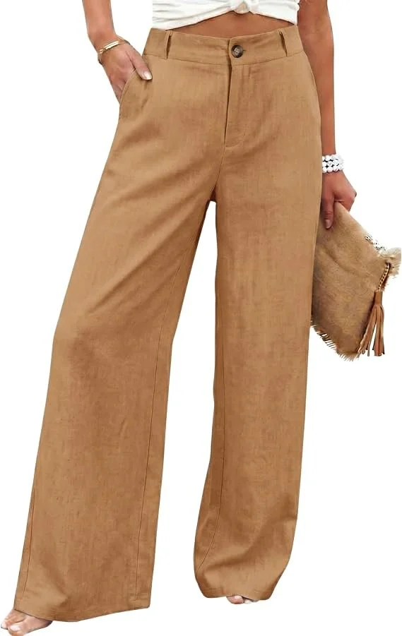 Woman wearing tan wide-leg trousers, holding a beige clutch purse with a tassel, and wearing jewelry.