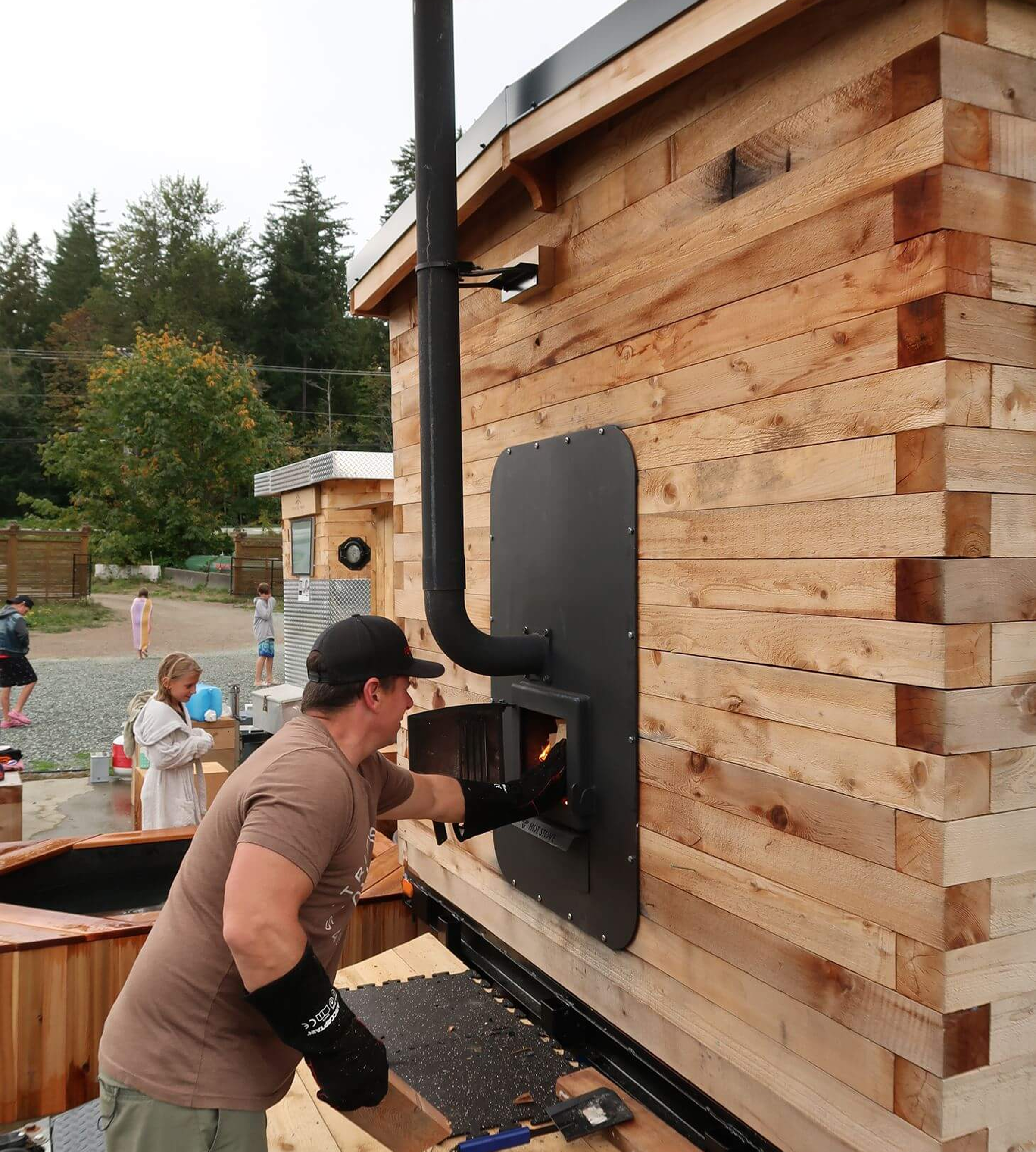 People assemble the wood in a sauna.