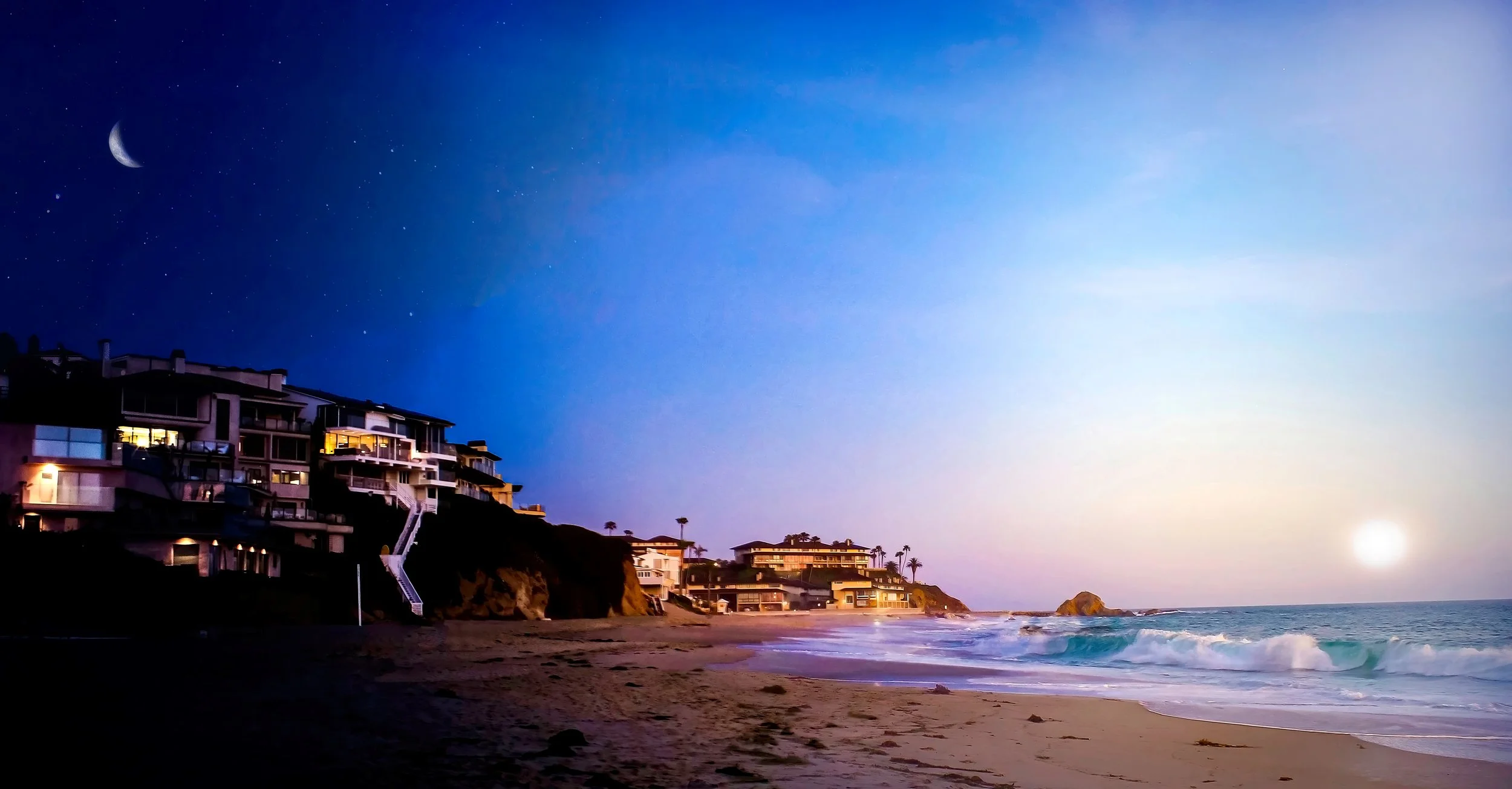 Coastal evening scene with modern beachfront houses on a hillside, a sandy beach with gentle waves, a clear sky with a crescent moon and visible stars, and a setting sun.
