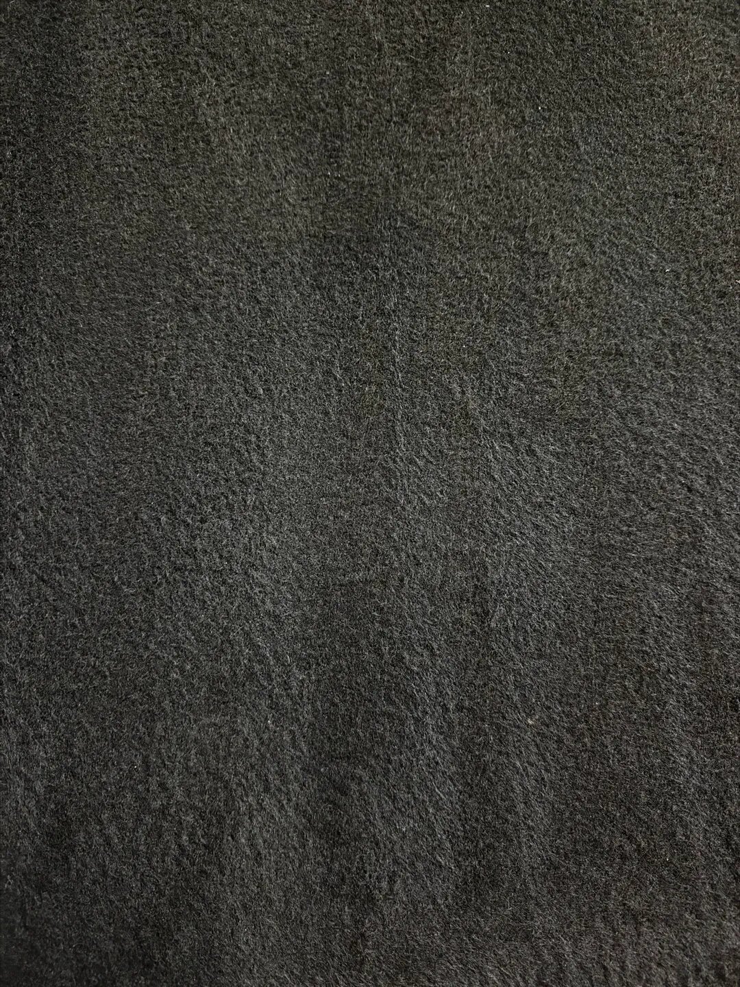 Close-up of a textured black surface.