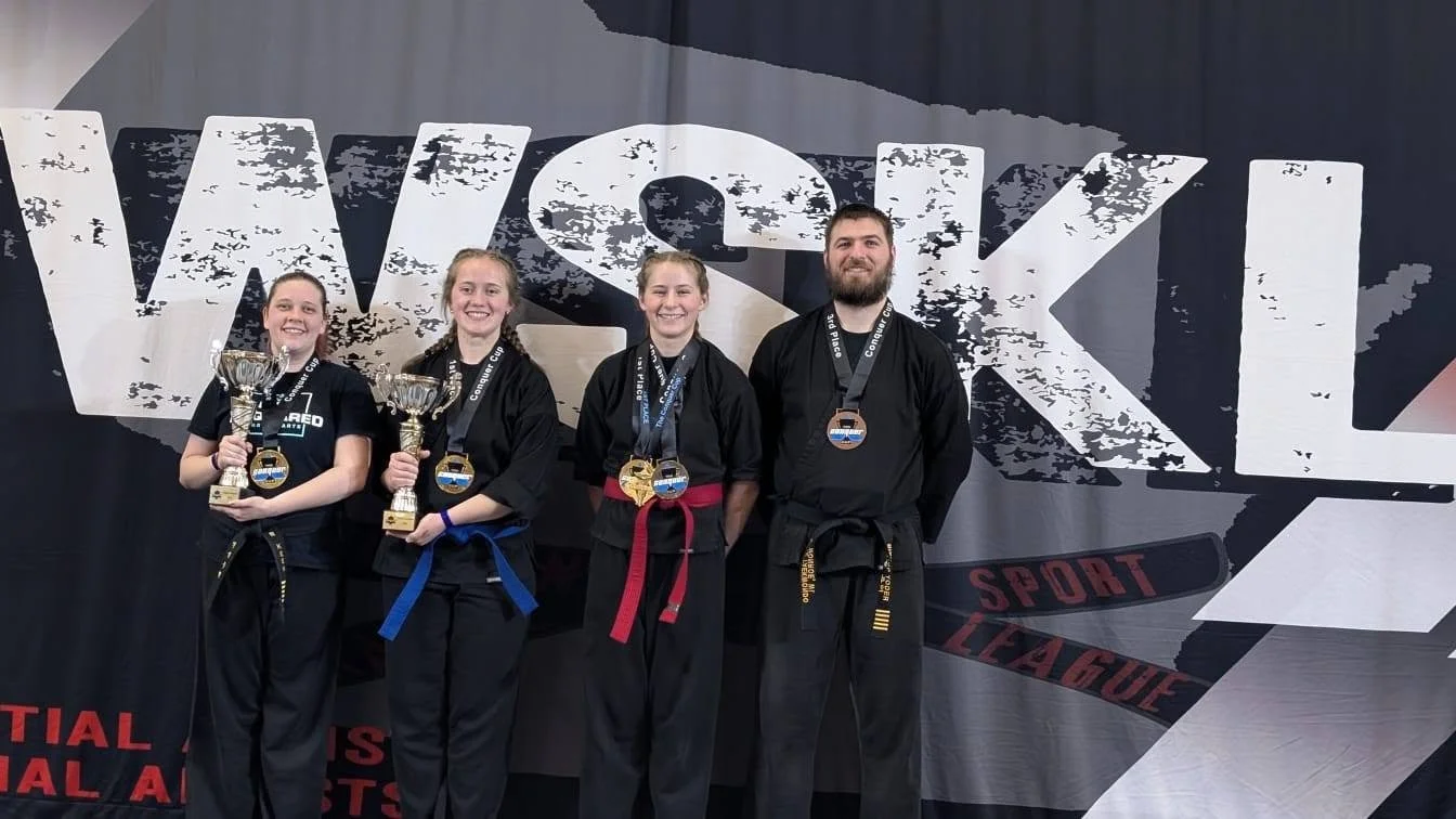 conquer cup 25 all 4 of us w cups.jpg