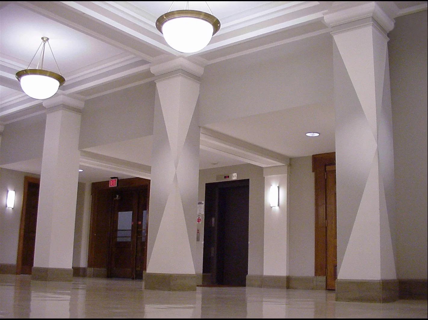  _____ Click to see entire horizontal  image _____  
Jeremy McDonnell
 Installation View _RV_Bricker4 
Four Shaped and Colored Elements added to existing architecture 
From the installation series: Render Visible 
Bricker Building , The Ohio State Un