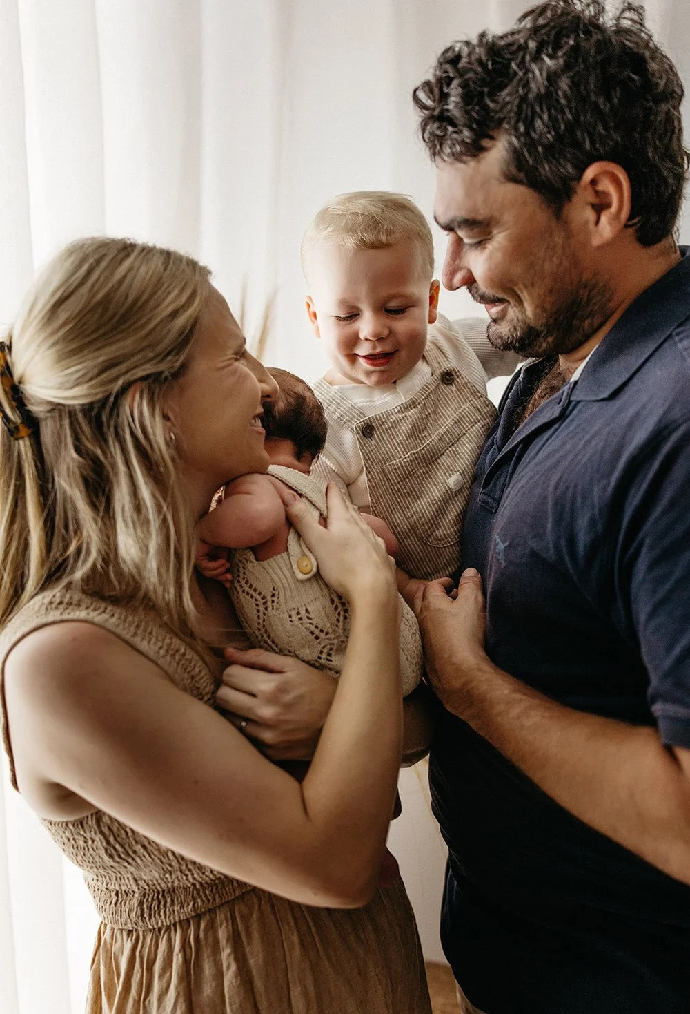 A mother, father, toddler and newborn. Family photo in NT by Captured by Cody photography.