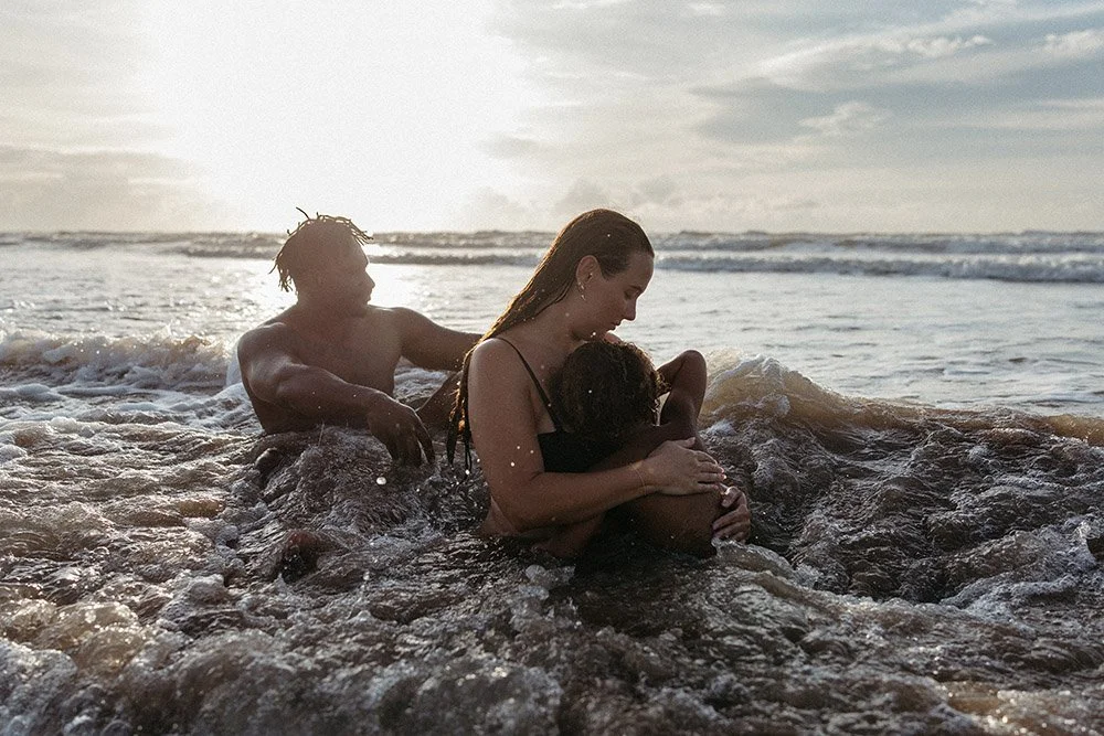 A young family on the beach in Darwin at sunset. Family photo session by Captured by Cody, NT.