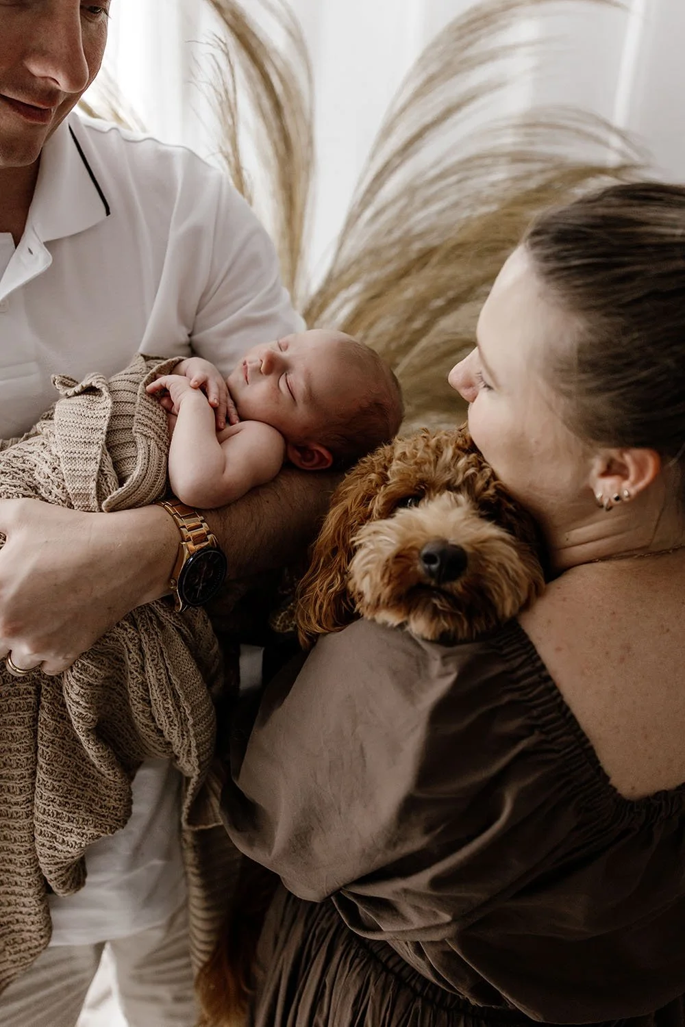 newborn-baby-with-parents-and-dog-photographer-darwin.jpg