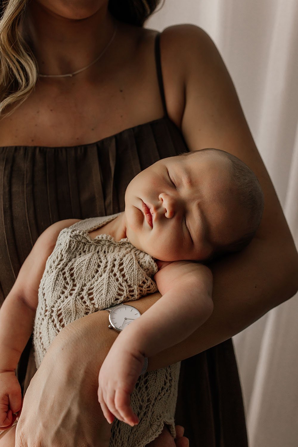 mother-holding-newborn-baby-nt.jpg