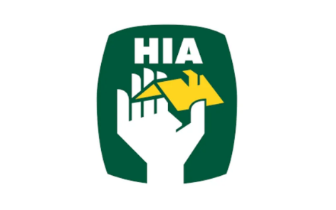 Logo with a green background, white text 'HIA', and a hand holding a yellow wrench.