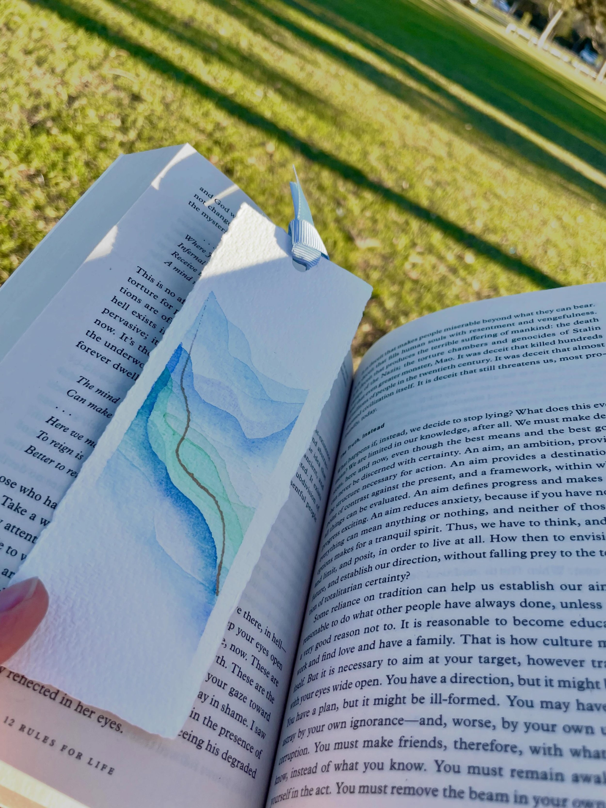 A bookmark for slow afternoons, open books, and stories worth returning to.

Hand-painted on textured paper, each piece is slightly different&mdash;just like the chapters it accompanies.

#BrushedChapter #BookmarkLover #HandPaintedBookmark #ReadingMo