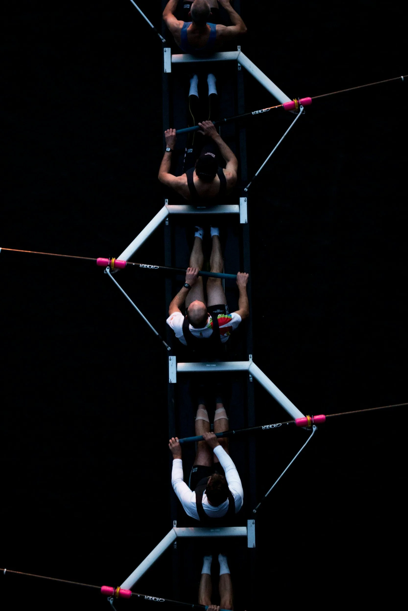 Rowing athletes competing — representing focus, synchronisation, and mental performance under sustained physical pressure.