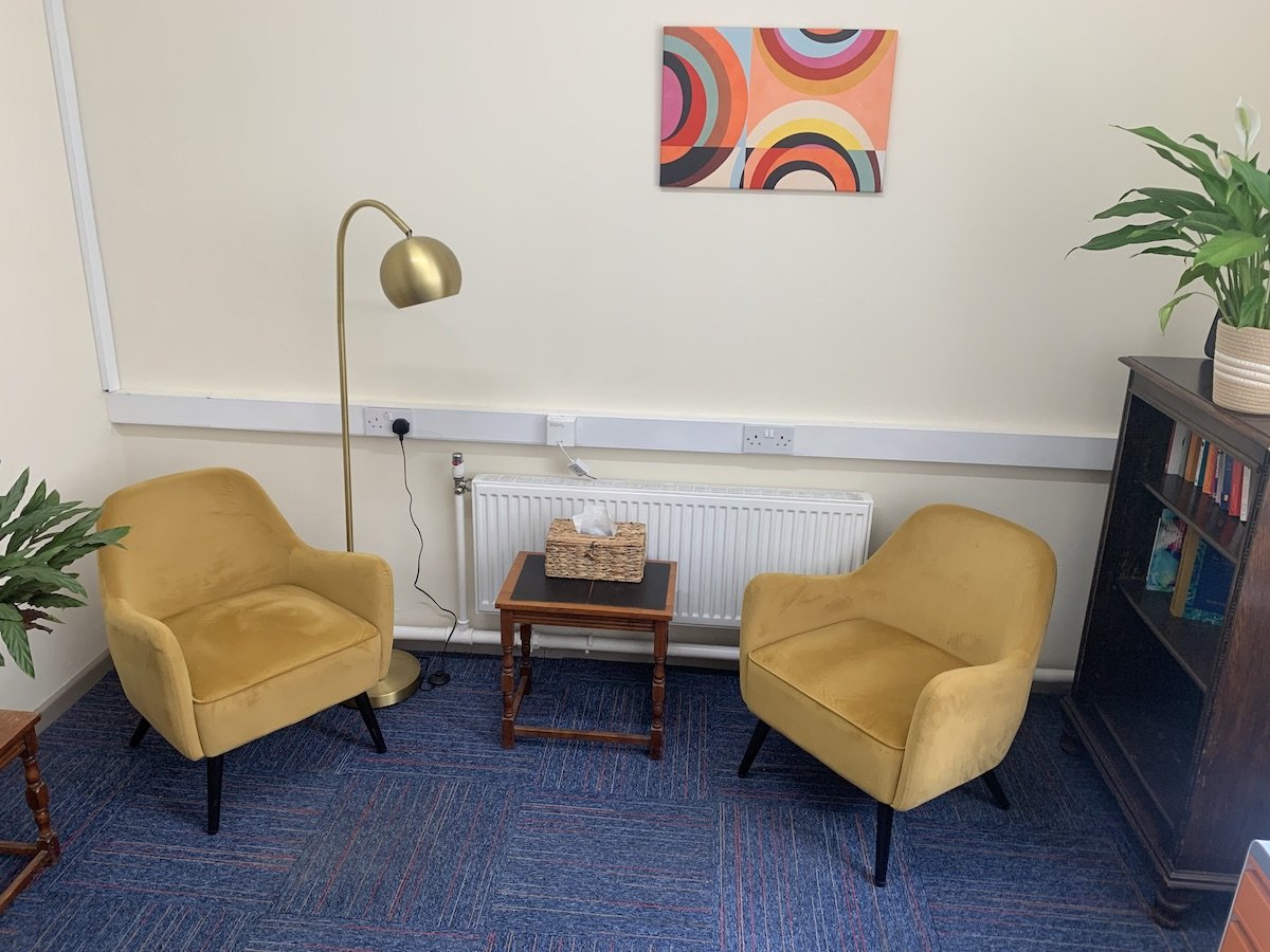 Counselling in Canterbury professional therapy room with cosy velvet chairs