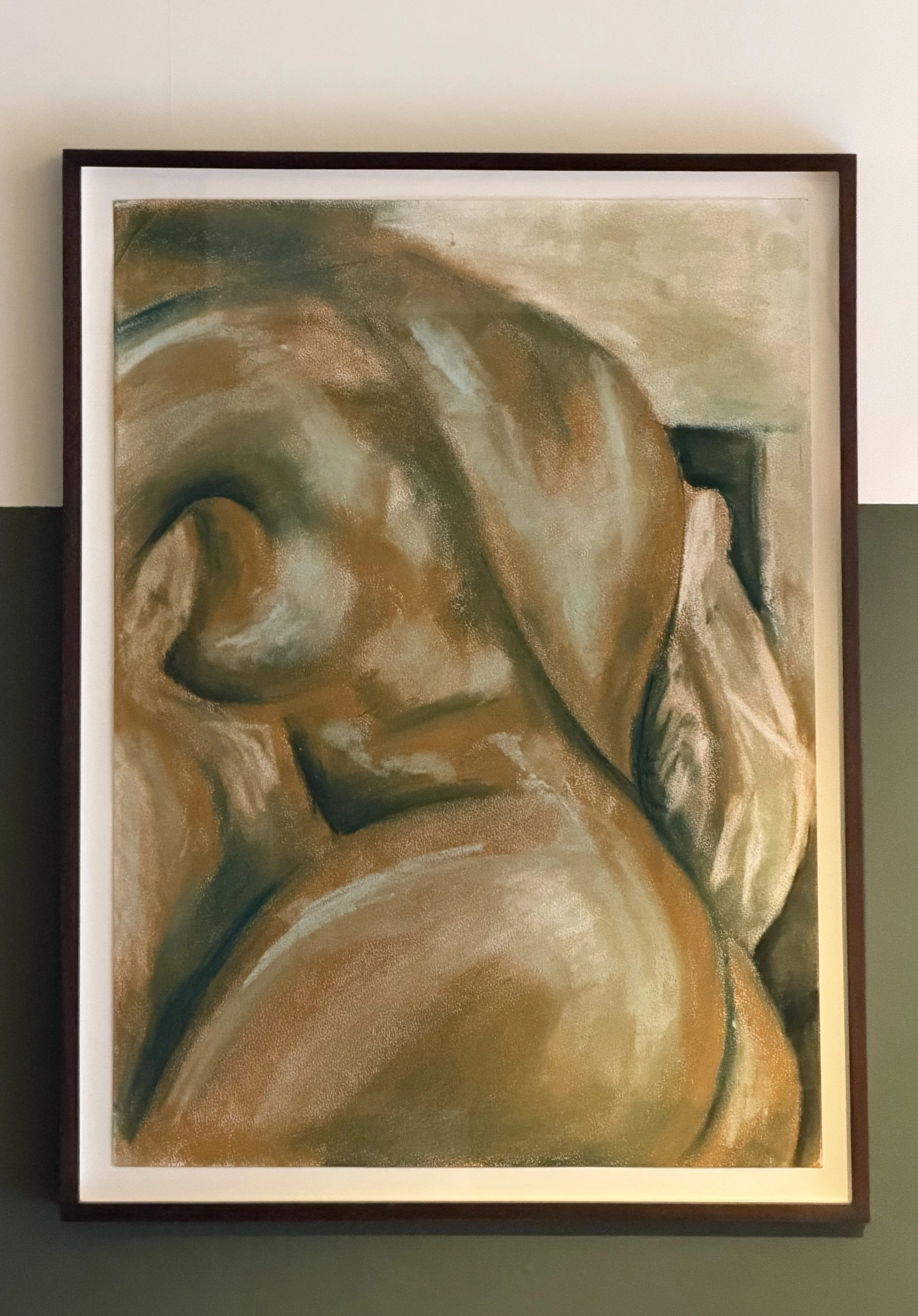 Close-up of an abstract painting with earthy tones, featuring smooth, curved shapes and a textured surface.