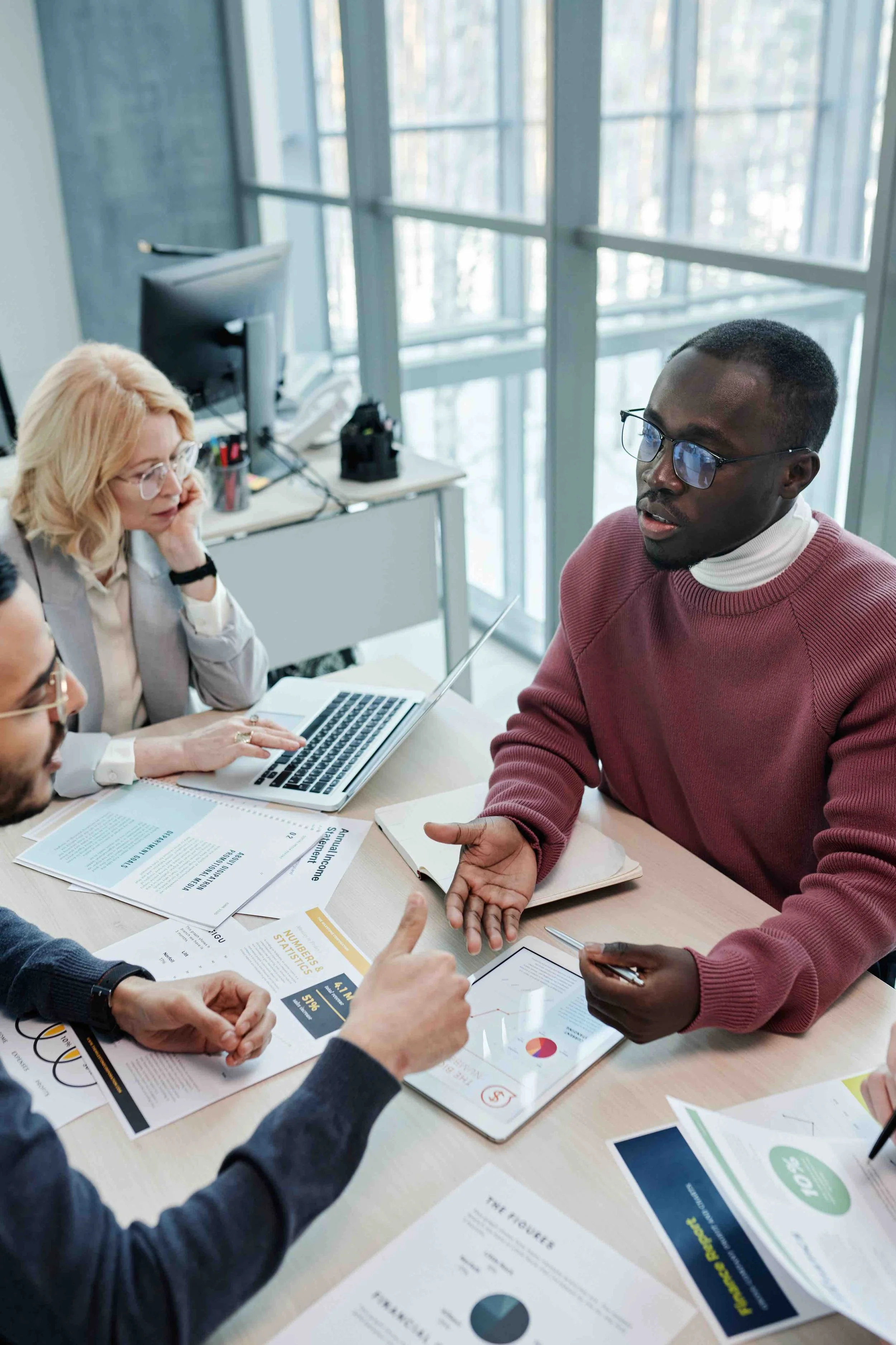 Insurance advisors and business leaders discussing affordable insurance solutions, coverage structures, and strategic insurance brokerage relationships.