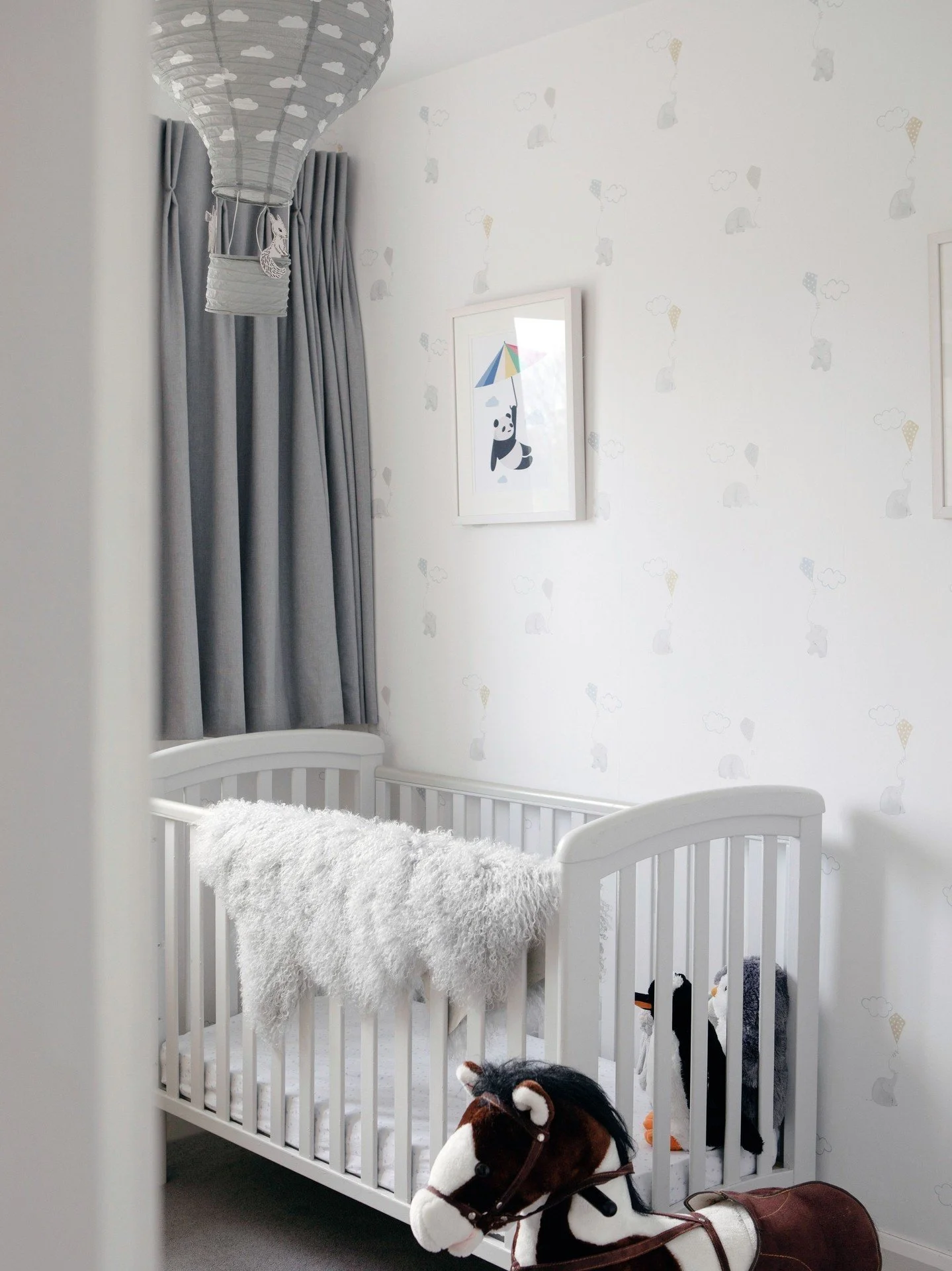 Children's rooms have to evolve much more quickly than most other rooms in a house.⁠
⁠
A nursery in particular is a relatively temporary space, so there's no need to over-design it.⁠
⁠
Here, we kept the room itself simple &mdash; a soft wallpaper, ne