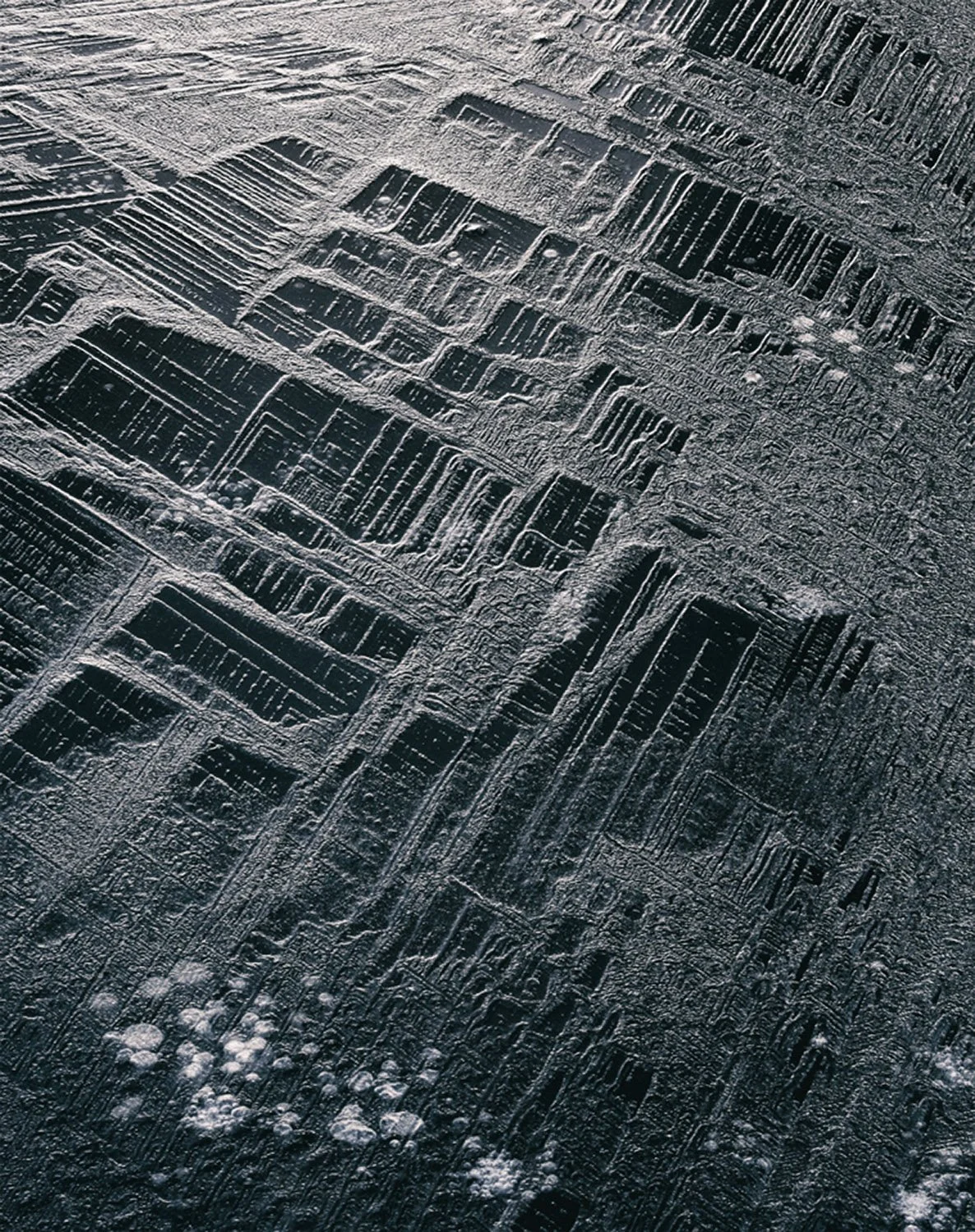 Snow-covered icy surface resembling a readout of sound waves