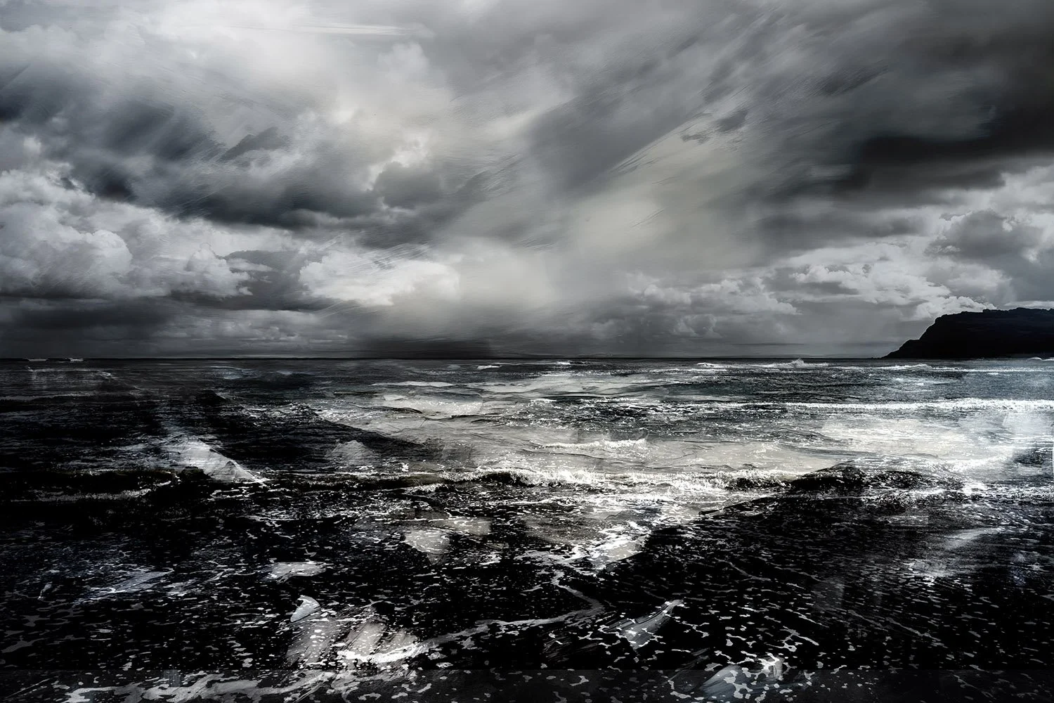 A turbulent ocean scene under a dark, stormy sky with heavy clouds and a distant landmass on the right.