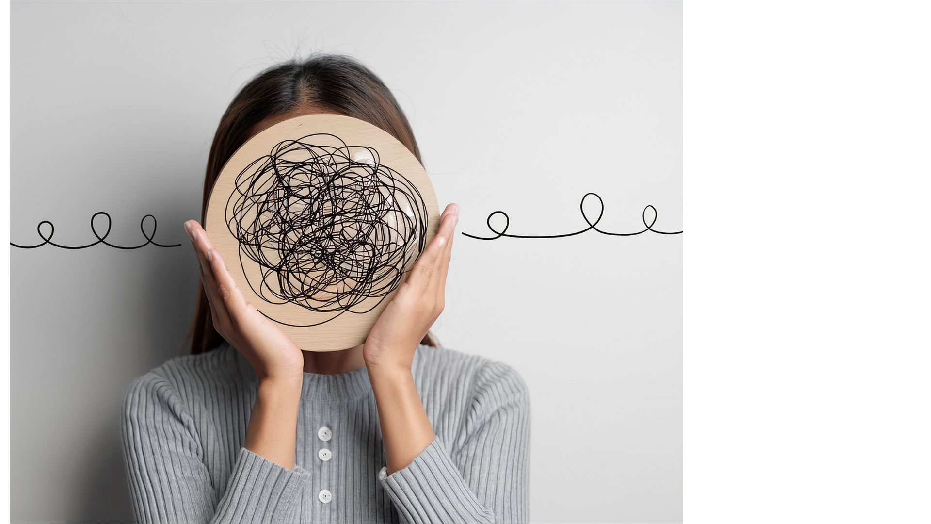 Person holding a wooden disc with a tangled black scribble in front of their face, with a line drawing of a continuous loop on a plain background.