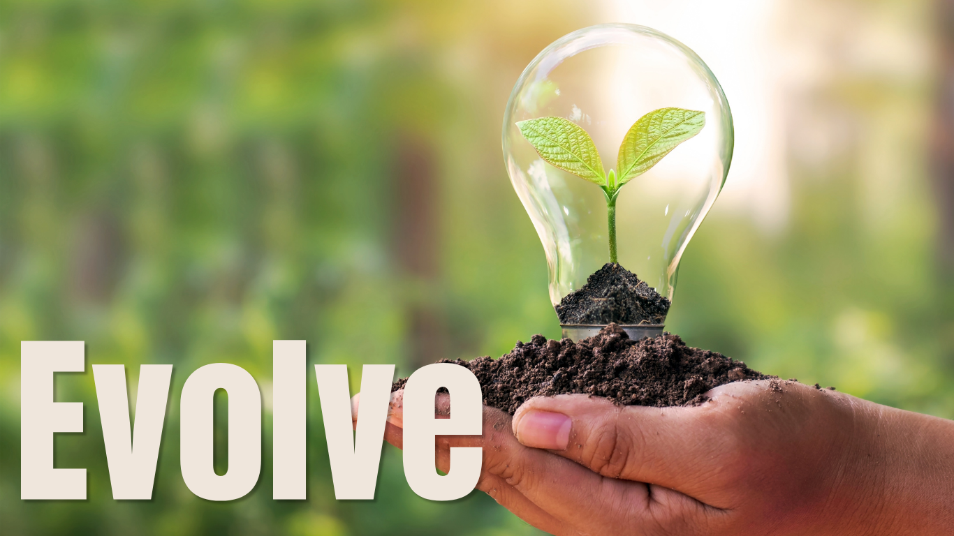 A person's hand holding soil with a glass lightbulb containing a small green plant, with the word "Evolve" in large white letters at the bottom left.