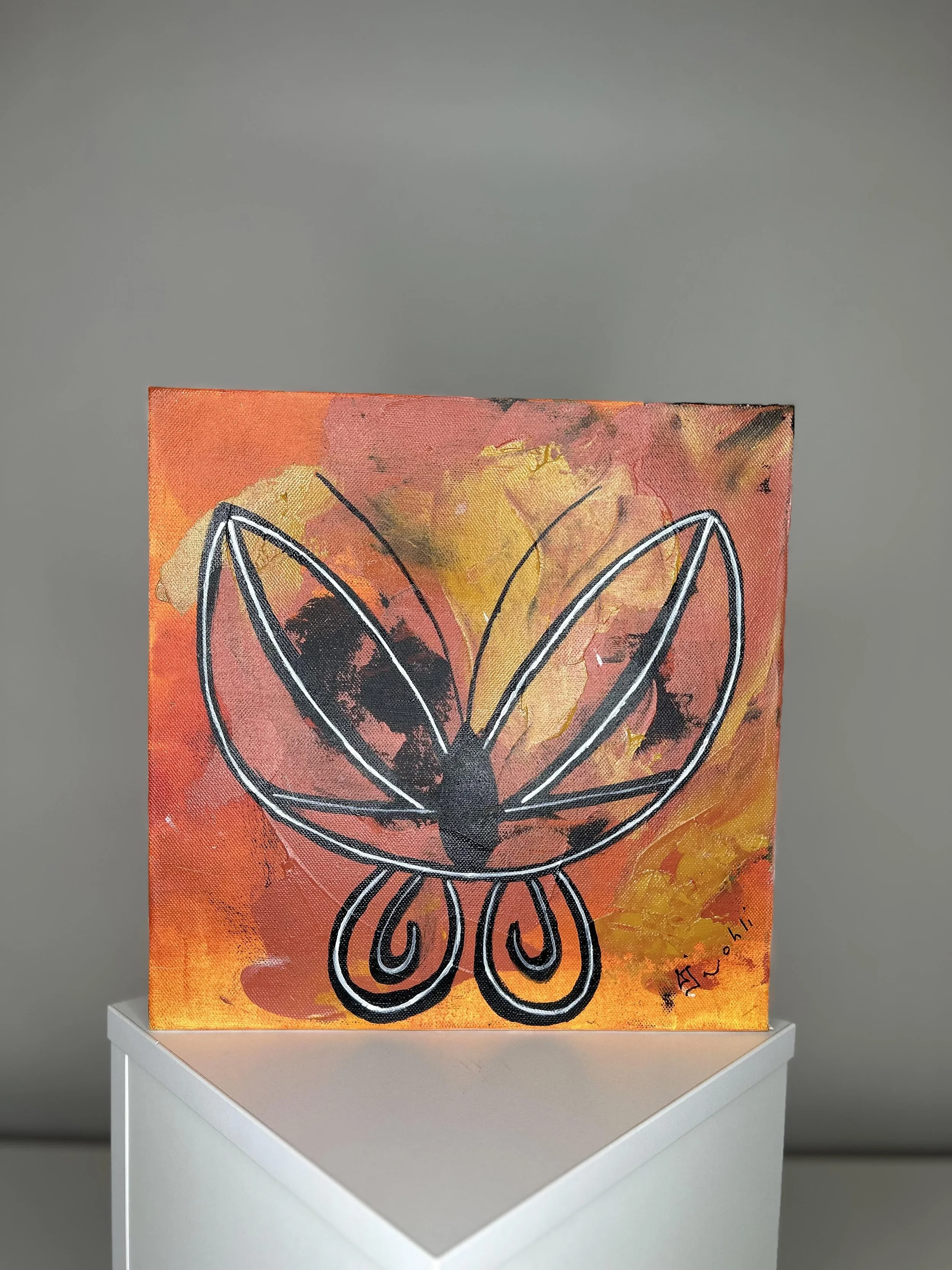 Abstract painting with black outlined butterfly shape on orange and yellow background, signed in the bottom right corner.