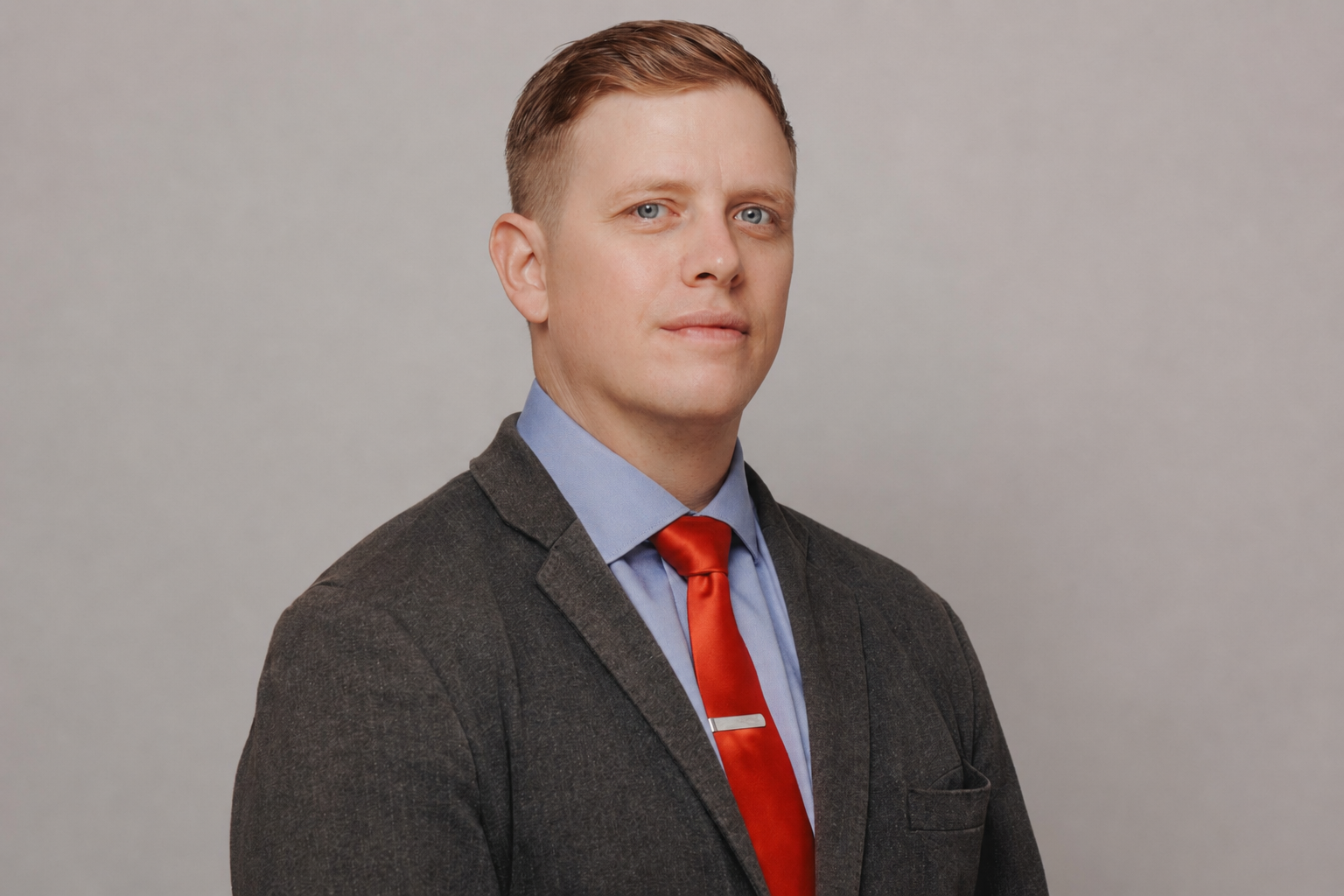 Michael James Przybylek, project management consultant, wearing a suit and red tie