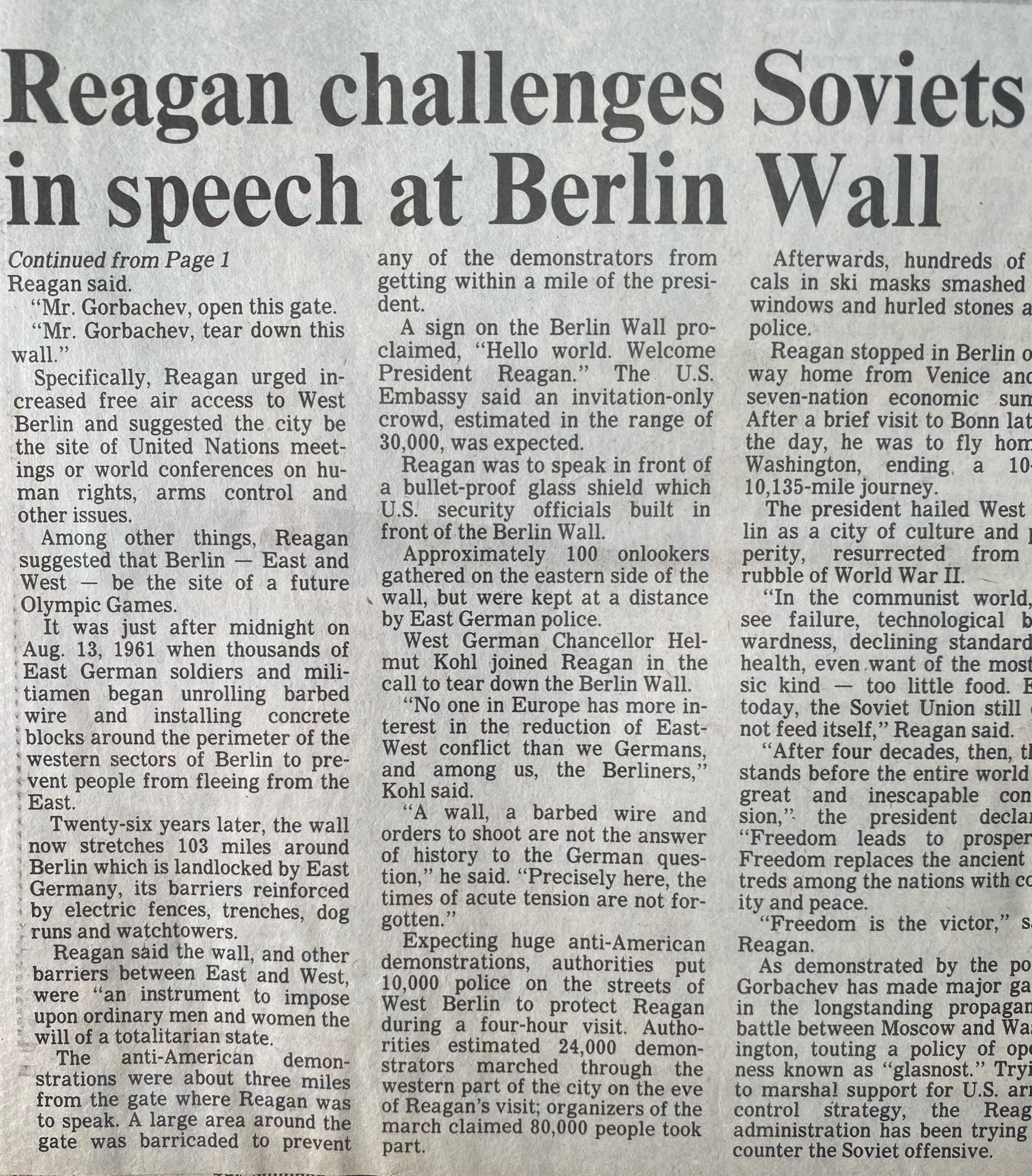This is a newspaper article about Reagan challenging Soviets in speech at the Berlin Wall. It includes details about the speech, the Berlin Wall, and historical context.