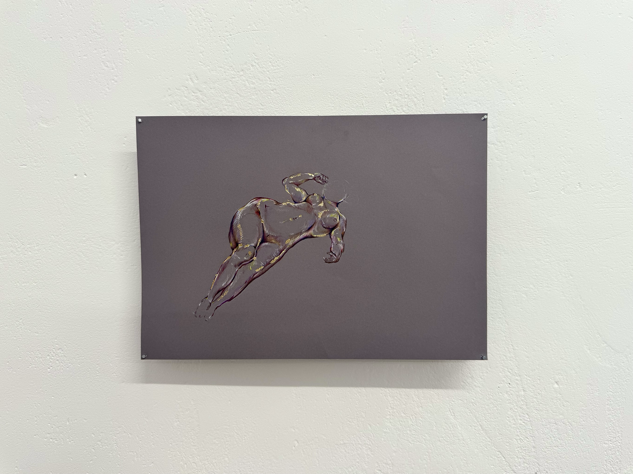 A piece of artwork depicting a stylized illustration of a woman with one arm raised above her head, painted on a dark background. The artwork is attached to a beige textured wall with four screws, one in each corner.