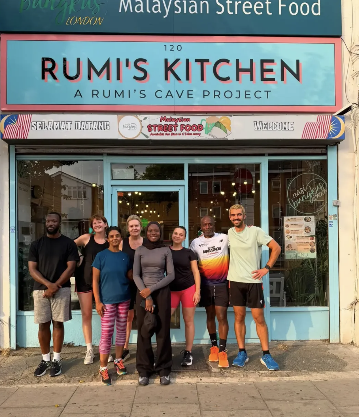 Our current home Rumi's Kitchen (2023 - present):  
Local community outside our premises.