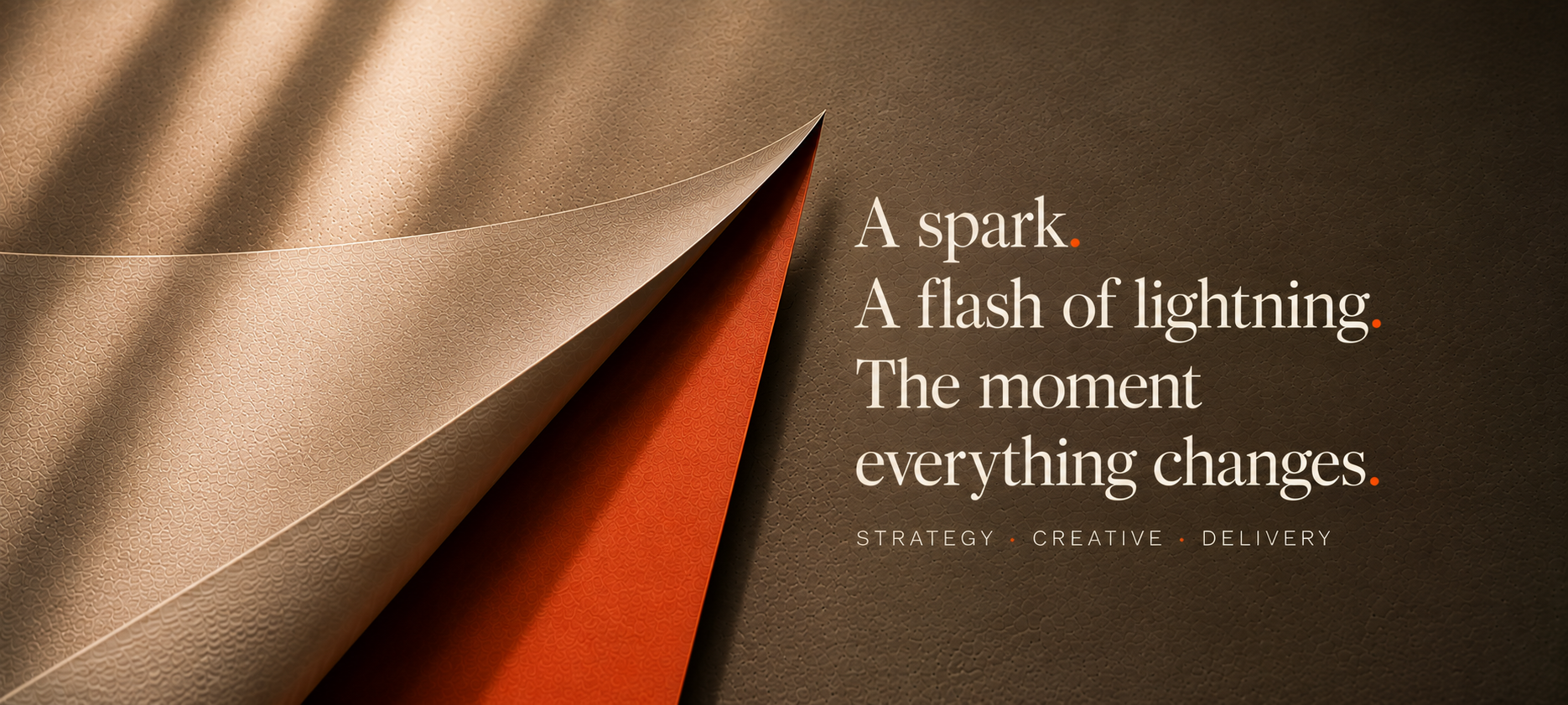 Close-up of layered textured papers in beige, orange, and brown on a dark brown background with a motivational quote about change and strategy.