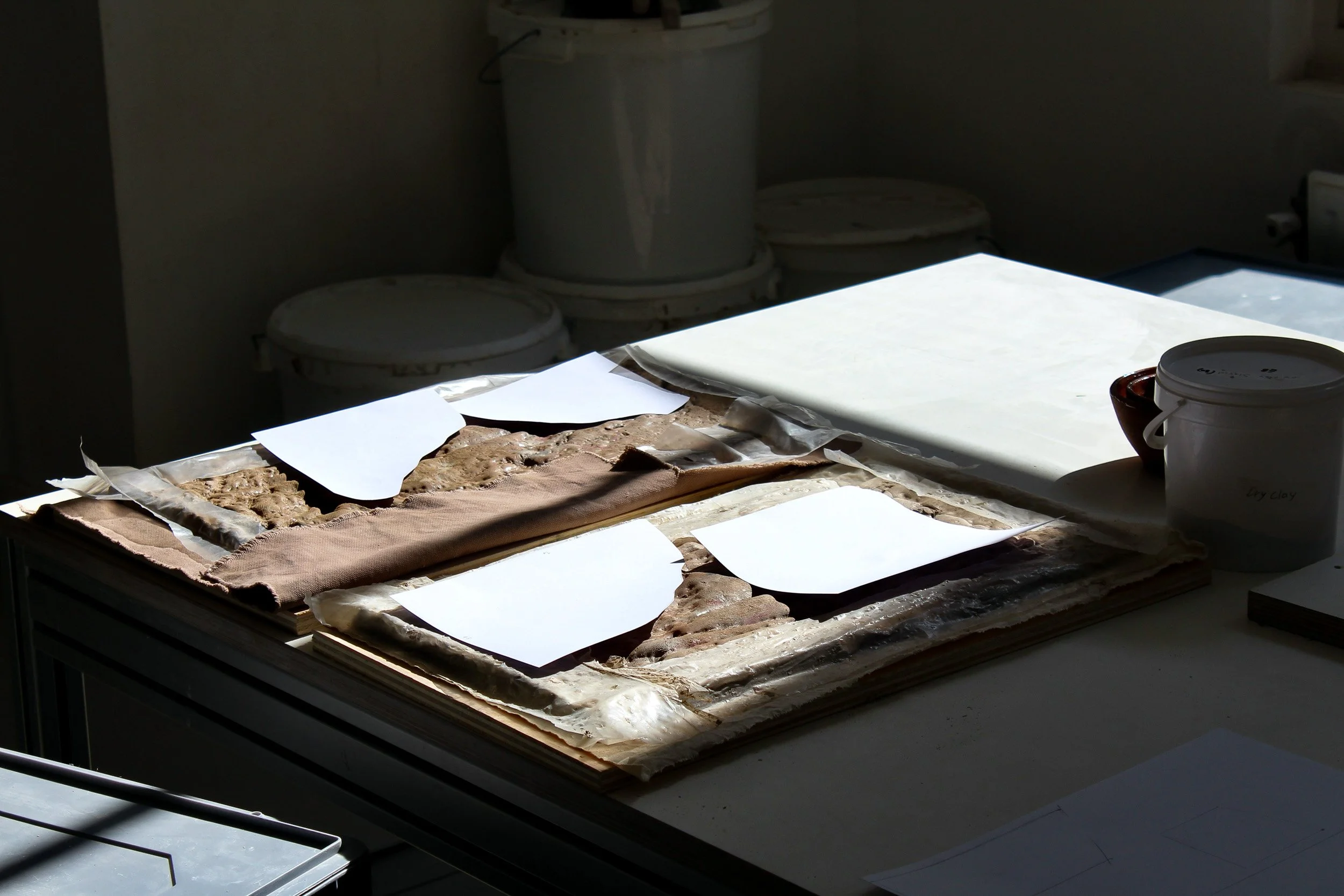 Worktable with materials and tools at Vuur Collective studio, Amsterdam. Behind the scenes photography by Isabel Hachmann-Peralt.