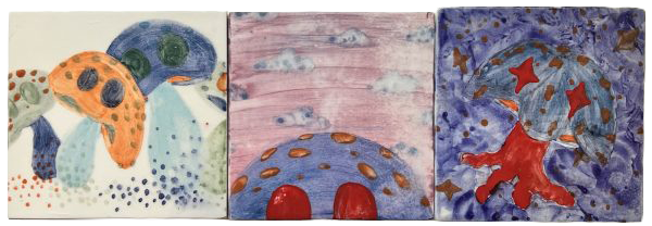 Three painted ceramic tiles with abstract designs and vibrant colors.