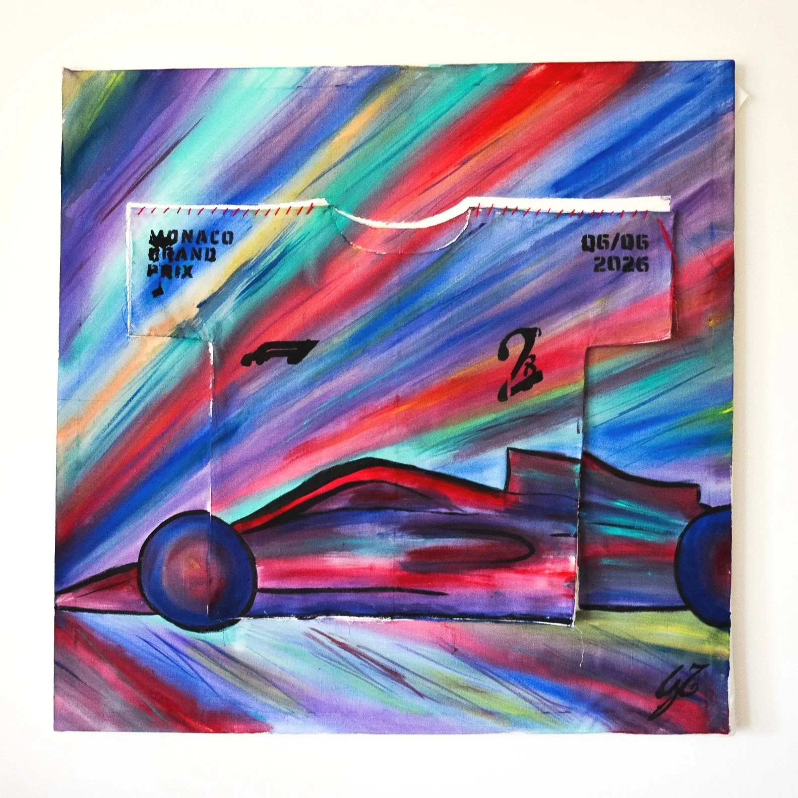 A colorful painting of a race car with a rainbow background. The car is black with blue wheels, and there are small details including the Monaco Grand Prix logo, date '05/06 2026,' and a stylized signature.