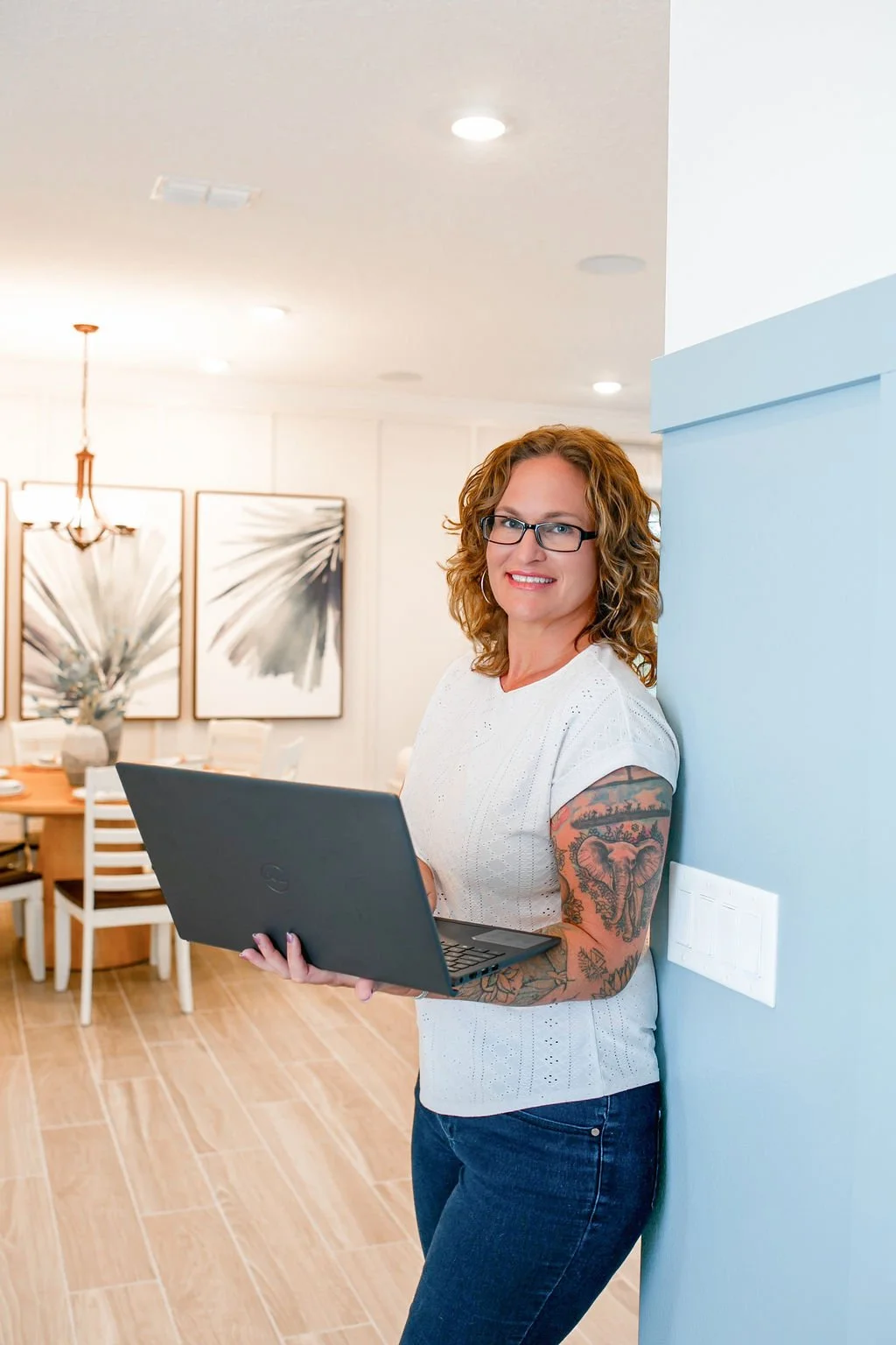 A modern woman graphic designer with a laptop for a professional graphic design portfolio.