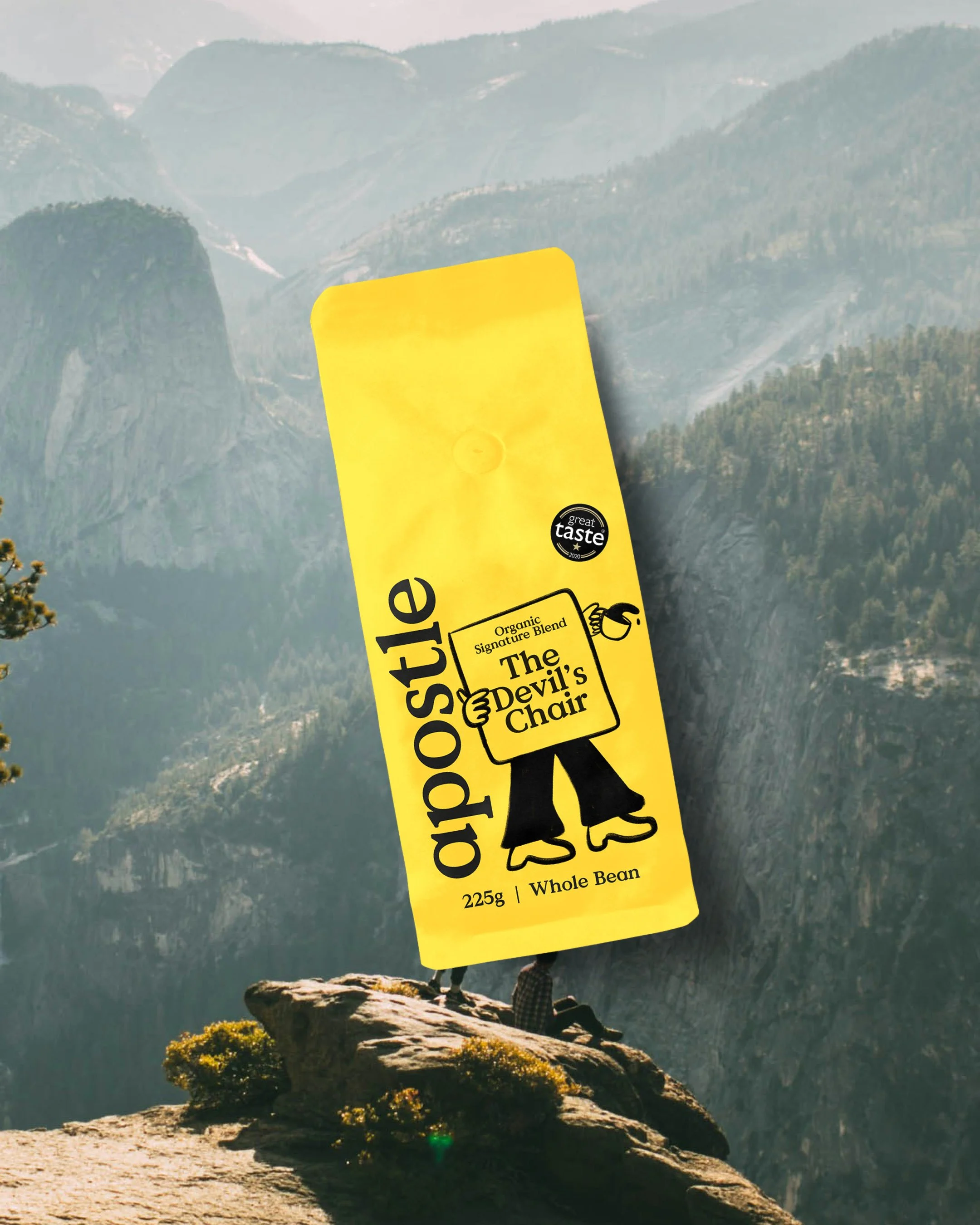 A scenic mountain landscape with a rock formation at the top and a person sitting on the edge. A large yellow energy bar-shaped object with text covering part of the view.