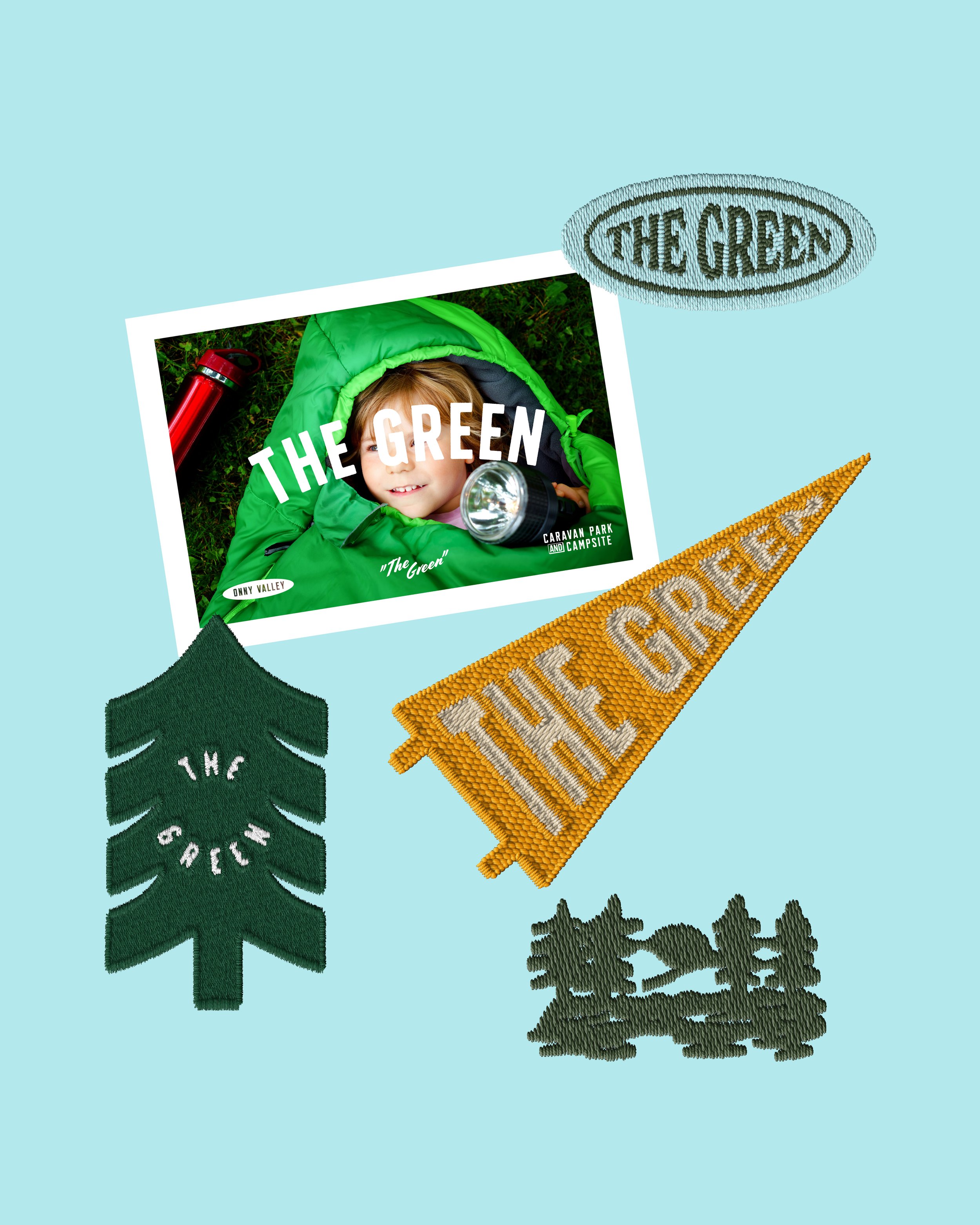 A magazine cover titled "The Green" featuring a young child in a green jacket lying down outdoors, holding a flashlight, with a red water bottle nearby, and surrounded by green foliage.