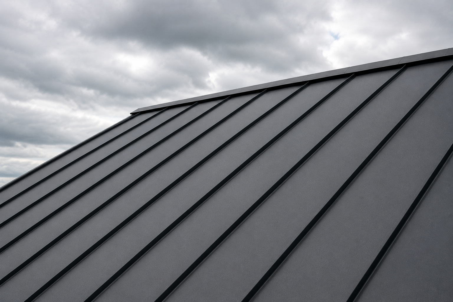 Close-up view of a metal roof with vertical panels under a cloudy sky.