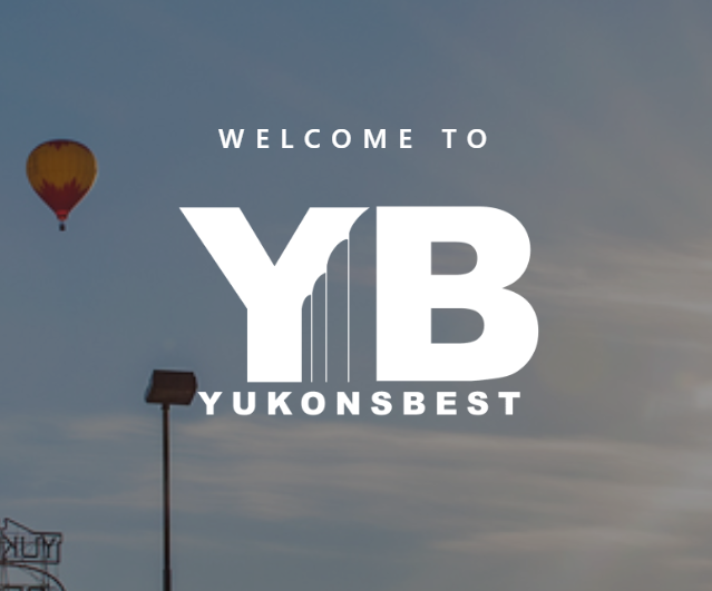 Sky with a hot air balloon and a signpost, with text overlay reading 'Welcome to YUKONS BEST'.